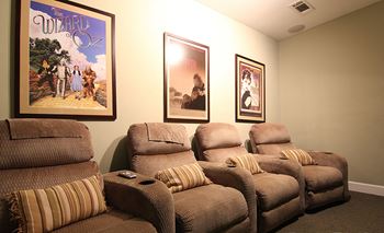 Spacious movie theatre with lounge chairs at the Haven at Reed Creek Apartments Martinez, GA